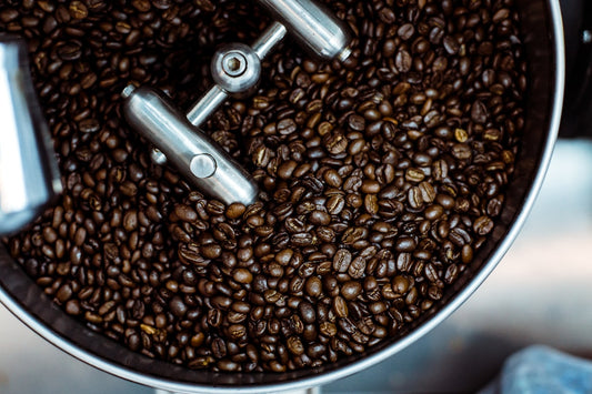 Close-up of freshly roasted coffee beans cooling after small batch roasting